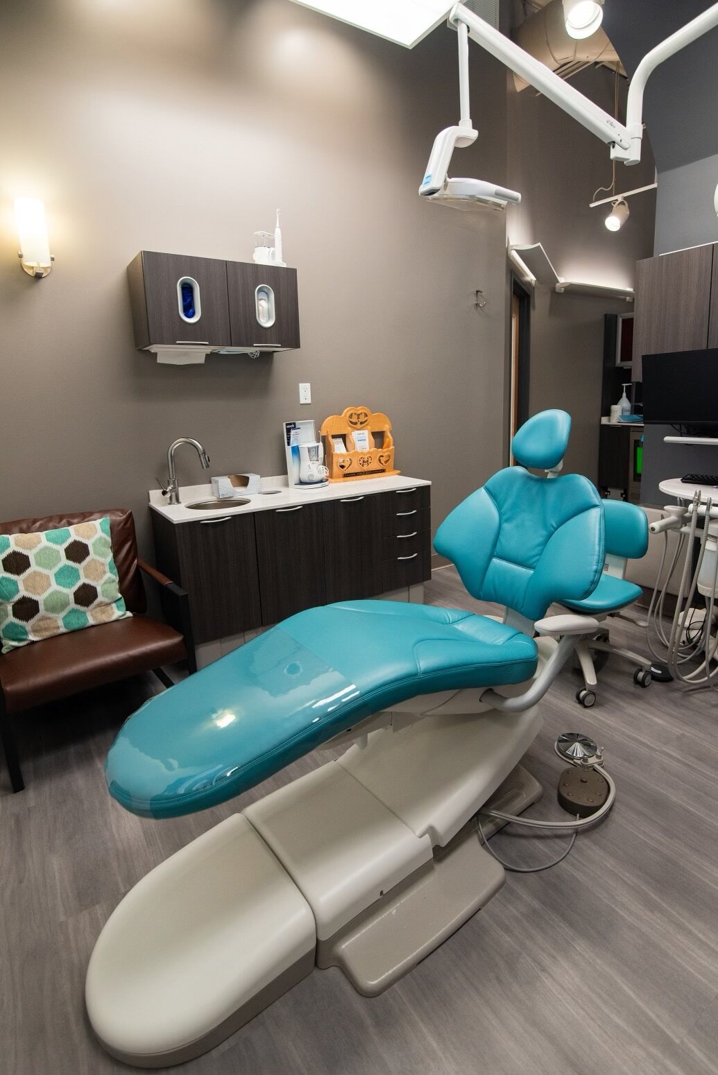 Dental treatment chair in a fully equipped operatory