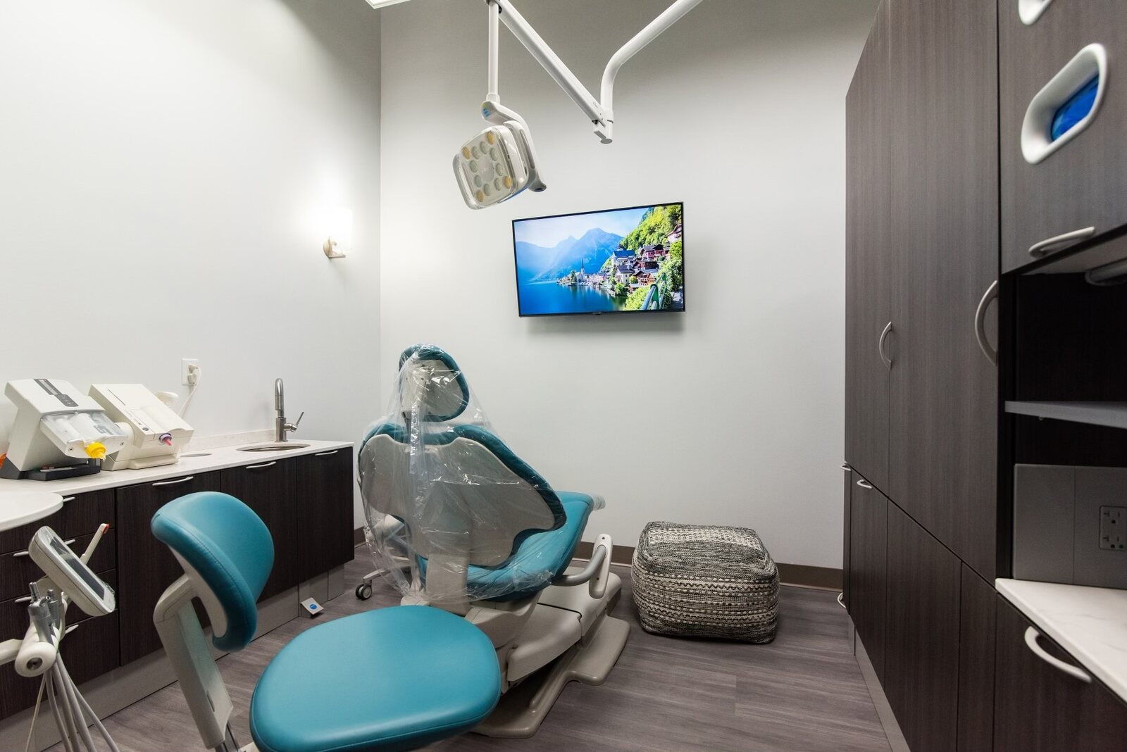 Treatment room with overhead TV for patient comfort