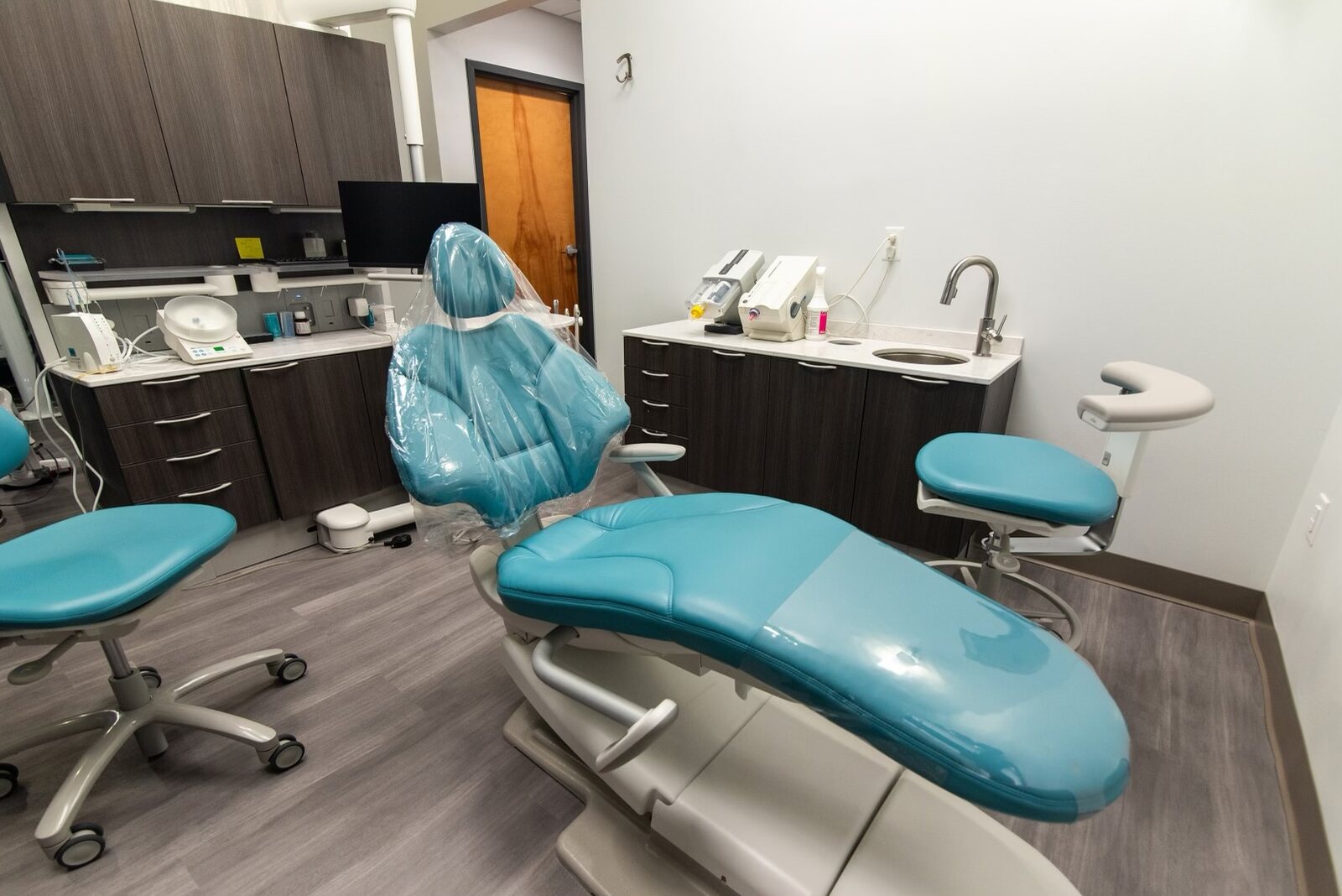 Treatment room with dental chair and equipment